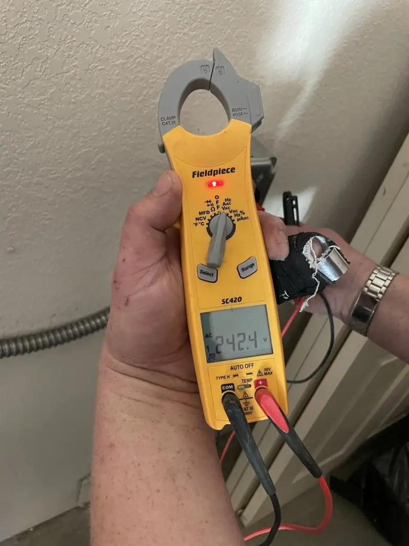 Voltage testing with clamp meter during Outlet Installation in Chico